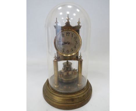 Gustav Becker Brass based Anniversary Clock under a Glass dome. Running order but no key present. Measures approx 12 inches t