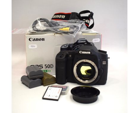 Canon EOS 50D Kit E/s 18/200.  No lens but has Charger. 