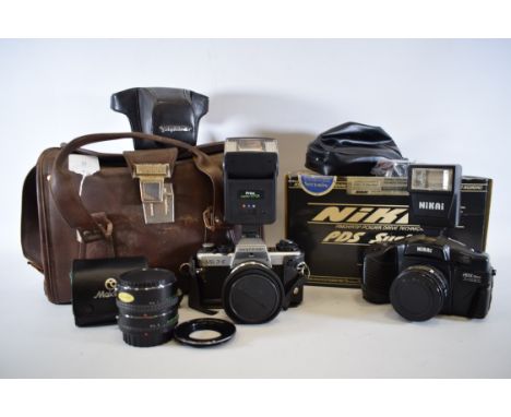 Nikai Auto power drive camera with flash plus a Voitlander VSL 35mm SLR camera plus accessories with leather case. See photos