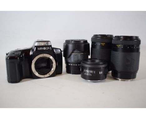 Minlota dynax 5000 SLR Camera body with Four lens.  See photo for details. 