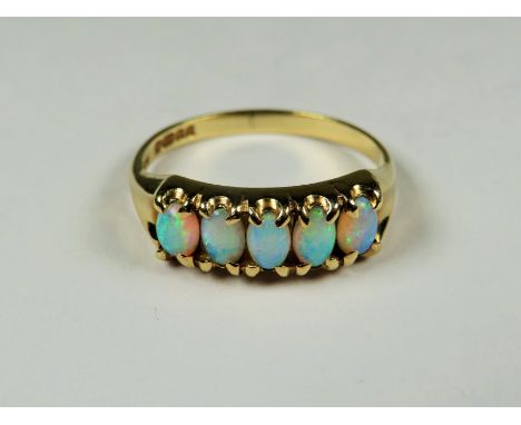 9ct Yellow Gold ring set with Five Opals.  Finger size 'P-5'   2.4g