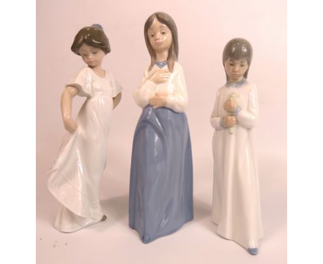 3 Nao figurines of girls the tallest stands 23cm.