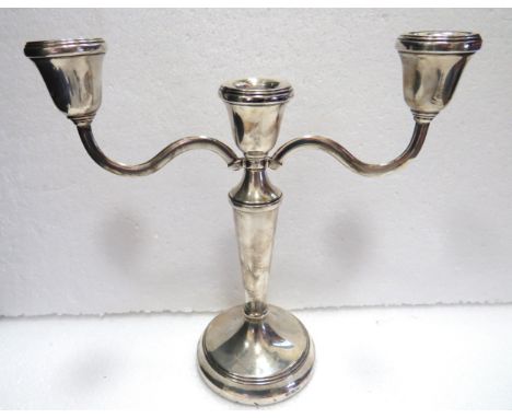 Hallmarked Silver Three Branch weighted candlestick which measures approx 8.5 inches tall.   See photos. 