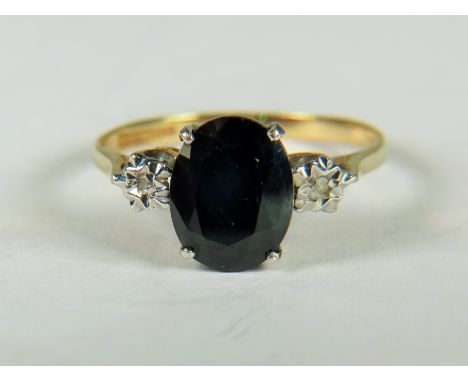 9ct Yellow Gold ring set with a Central oval Sapphire with Diamonds set to shoulders.   Finger size 'N-5'   1.6g