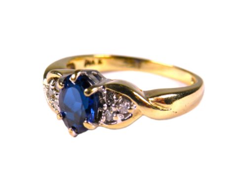 9ct Yellow Gold Ring set with an Oval Central Sapphire, Groups of Melee Diamonds to shoulders.  Finger size 'M'    2.9g