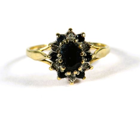 9ct Yellow Gold ring set with a central Sapphire with sapphire and Diamond surround in a flower pattern.  Finger size 'K-5'  