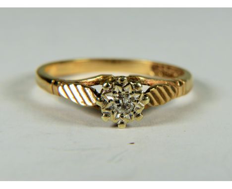 9ct Yellow Gold ring with a Diamond set in a flower pattern.  Finger size 'Q'     2.4g