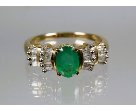 9ct Yellow Gold Ring set with a Central Oval Emerald surrounded by multiple Diamonds.  Finger size 'P'    2.6g