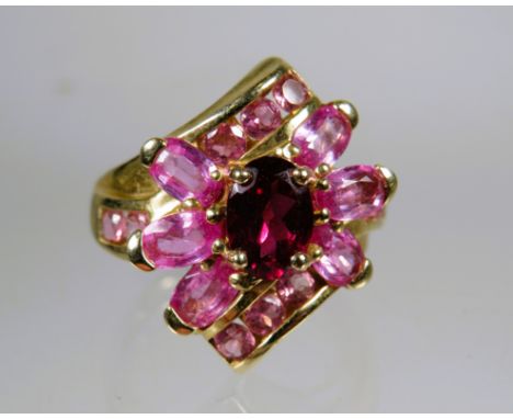 9ct Yellow Gold Ring set with Pink Tourmaline in a flower pattern.   Finger size 'M'    4.5g
