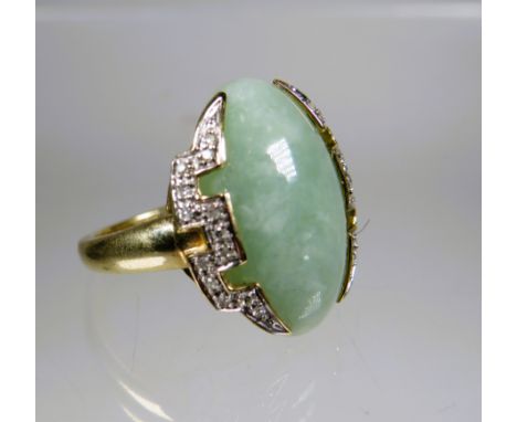 9ct Yellow Gold Ring set with a large Oval shaped Jade which measures 20 x 15 mm surrounded by Melee Diamonds In a geometric 