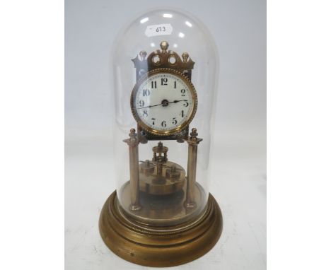 German Made Brass based Anniversary clock with enamel Dial. Sits under a Perspex dome which measures approx 12 inches tall.  
