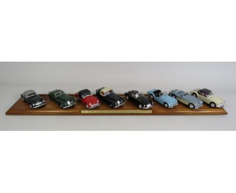 The Corgi classic sports car collection 8 diecast sports cars in boxes and wooden display plinth.