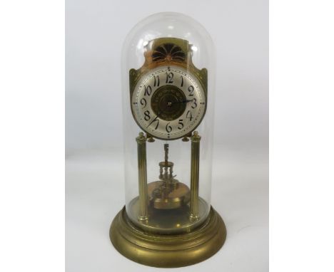 Large German Made Brass Based Anniversary clock under Glass dome which measures approx 14 inches tall. Running order but no k