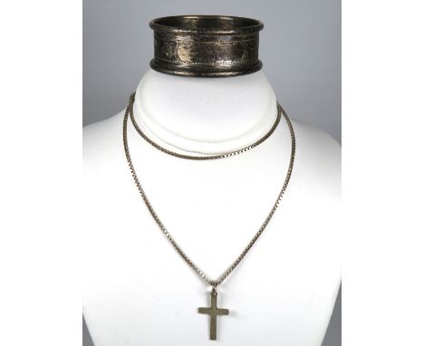 Silver Crucifix hung on a Silver Cage link chain together with a Hallmarked Silver Napkin Ring.   Total weight 9.8g