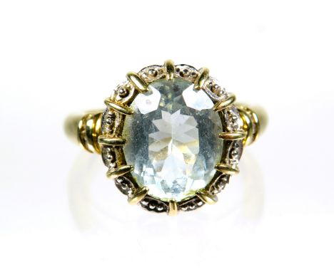 9ct Yellow Gold Ring set with a large Oval pale or White Topaz which measures approx 12 x 10mm. Finger size 'O-5'    4.1g