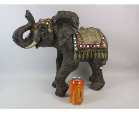 Large resin elephant sculpture decorated with mirrors, jewels and mother of pearl, it stands approx 45cm tall and 60 cm long