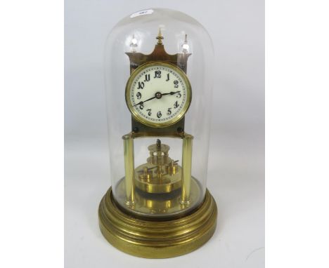 Gustav Becker Brass based Anniversary Clock under a Glass dome. Running order but no key present. Measures approx 12 inches t