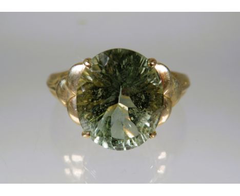 9ct Yellow Gold Ring set with a large Oval Green Quartz which measures approx 12 x 10 mm.   Finger size 'P'   Total Weight 4.
