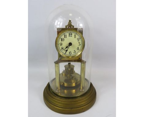 Gustav Becker Brass based Anniversary Clock under a Glass dome. Running order but no key present. Measures approx 12 inches t