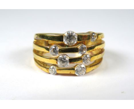 9ct Yellow Gold Ring set with CZ Stones on four strands in the patten of Pleiades Constellation.   Finger size  'P'     5.4g