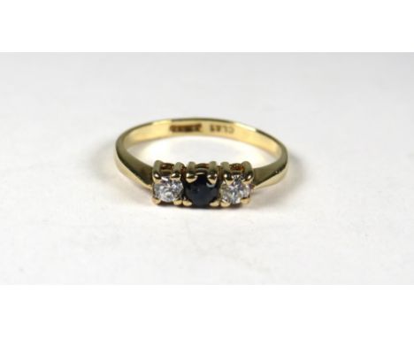 9ct Yellow Gold ring set with a small Central Sapphire Flanked by CZ.  Finger size 'K'    1.3g