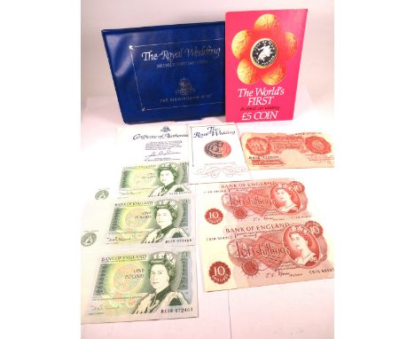 Interesting Numismatic lot to include Three near mint one pound notes, two with consecutive numbers, Two Near mint 10 shillin