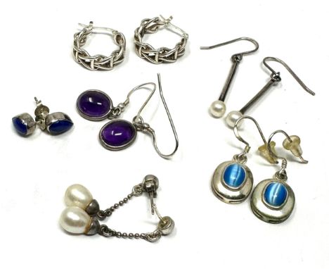 6 pairs of silver earrings