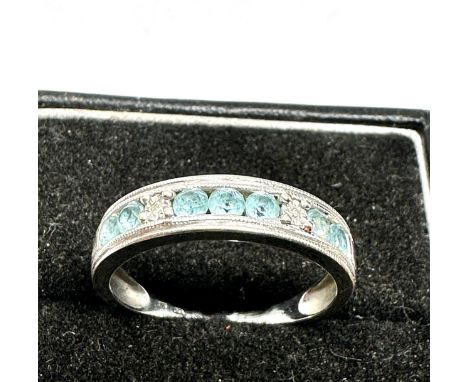 9ct white gold diamond and topaz set half hoop eternity ring (2.3g)