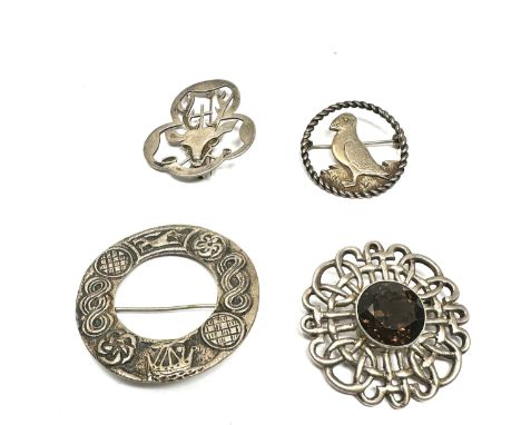 Four silver antique Scottish/Celtic brooches including gemstone (49g)