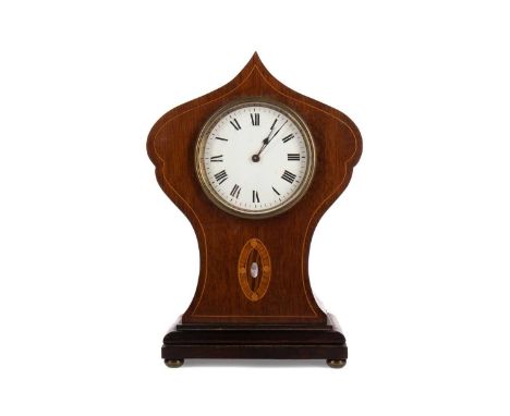 ARTS &amp; CRAFTS MAHOGANY MANTEL CLOCK,with one train movement, the white enamel dial with Roman numerals, the shaped balloo