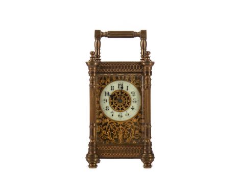 LATE VICTORIAN CARRIAGE CLOCK,with one train movement, the face with fretted scroll and foliate decoration, with white enamel