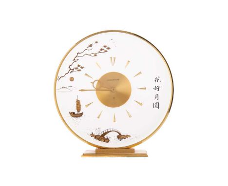 JAEGER LeCOULTRE 'MARINA' MANTEL CLOCK,with eight day movement, the circular frosted lucite dial with gilt metal dagger hour 