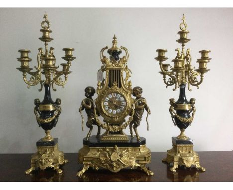 REPRODUCTION MANTLE CLOCK GARNITURE,of French Empire design, gilt and bronzed metal with German quartz movement, the chapter 