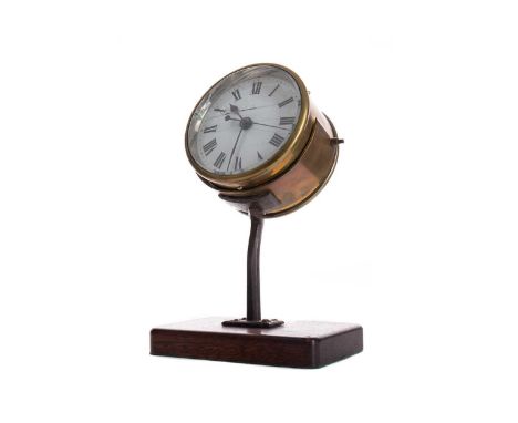 EARLY 20TH CENTURY GENERAL POST OFFICE DRUM DESK CLOCK,the white enamel dial with Roman numerals, the brass surround inscribe