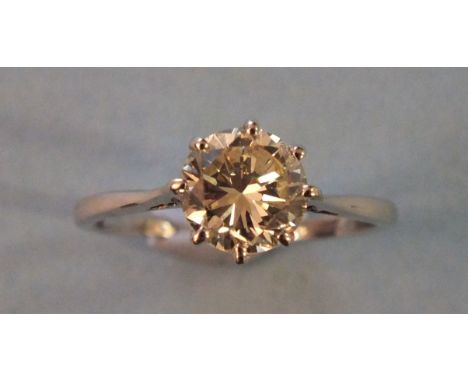 A certificated solitaire diamond ring claw set a brilliant cut diamond of 1.71cts in 18ct gold and platinum mount, the accomp