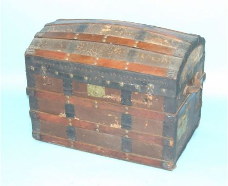 A late-Victorian metal and wood-bound hessian-covered travelling trunk with domed lid and old shipping labels for Castle Line