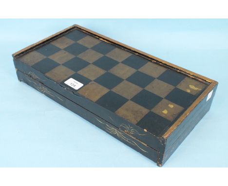 A mahogany three-division tea caddy, a lacquered back gammon board, bone chess pieces and ivory draughts.