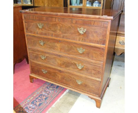 An early 19th century mahogany chest of four cockbeaded drawers, on bracket feet, 116cm wide.