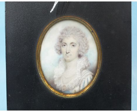 19th Century English School MINIATURE PORTRAIT OF A YOUNG WOMAN WEARING A DOUBLE STRING OF PEARLS AND LOCKET, NUMBERED IV, 7.