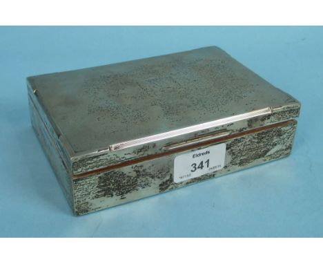 A rectangular silver cigarette box with engine turned engraving, Birmingham 1959, 16.5 x 11 x 4cm.