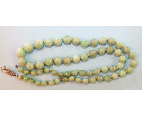 A jade necklace of sixty graduated spherical beads, graduating from 5mm to 9.5mm approximately, 54cm long, with 9ct white gol