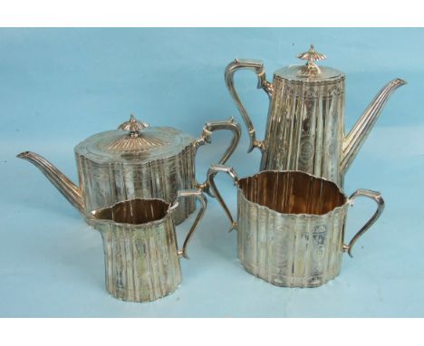 A Victorian four-piece silver tea service of oval reeded and tapered form with engraved decoration and borders, maker WS/CS, 