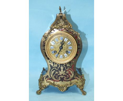 A Victorian ebonised and Boulle mantel clock, the gilt metal dial with ceramic numerals and gong striking movement, 29cm high