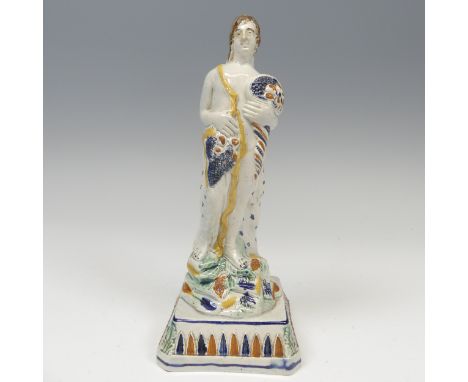 A 19thC prattware figure of Summer, modelled with cornucopia cluthed in arm, raised on plinth base with figured leaf decorati