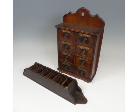 A Vintage wall hanging spice Cupboard, with eight drawers all with plaques, W 24.5 cm x H 40.5 cm x D 9.5 cm, together with a