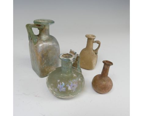 A Roman iridescent glass Flask, with handle connecting neck with spherical body, H 7cm, together with another Roman iridescen