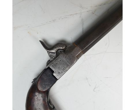 An unusual long barreled percussion Pistol, 50cm barrel (later addition),&nbsp;folding trigger, wooden butt with hinged pelle