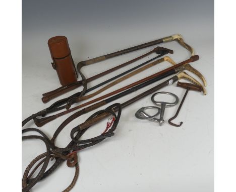 A silver mounted riding Crop by 'Whippy Saddler, London', together with another silver mounted riding crop and some others si