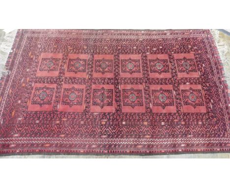 Tribal Rugs; a light-red ground Afghan rug, wool pile on wool base, 219cm x 126cm, good overall condition. 