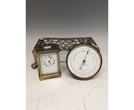 A circular Holosteric Barometer by W. Heath &amp; co, Plymouth,&nbsp;the brass back also marked 'HPBN', diameter 12.5 cm, tog